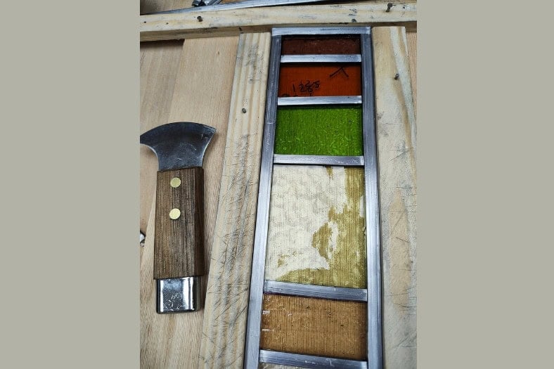 A photo of a stained glass sculpture being made - stained glass garden art.